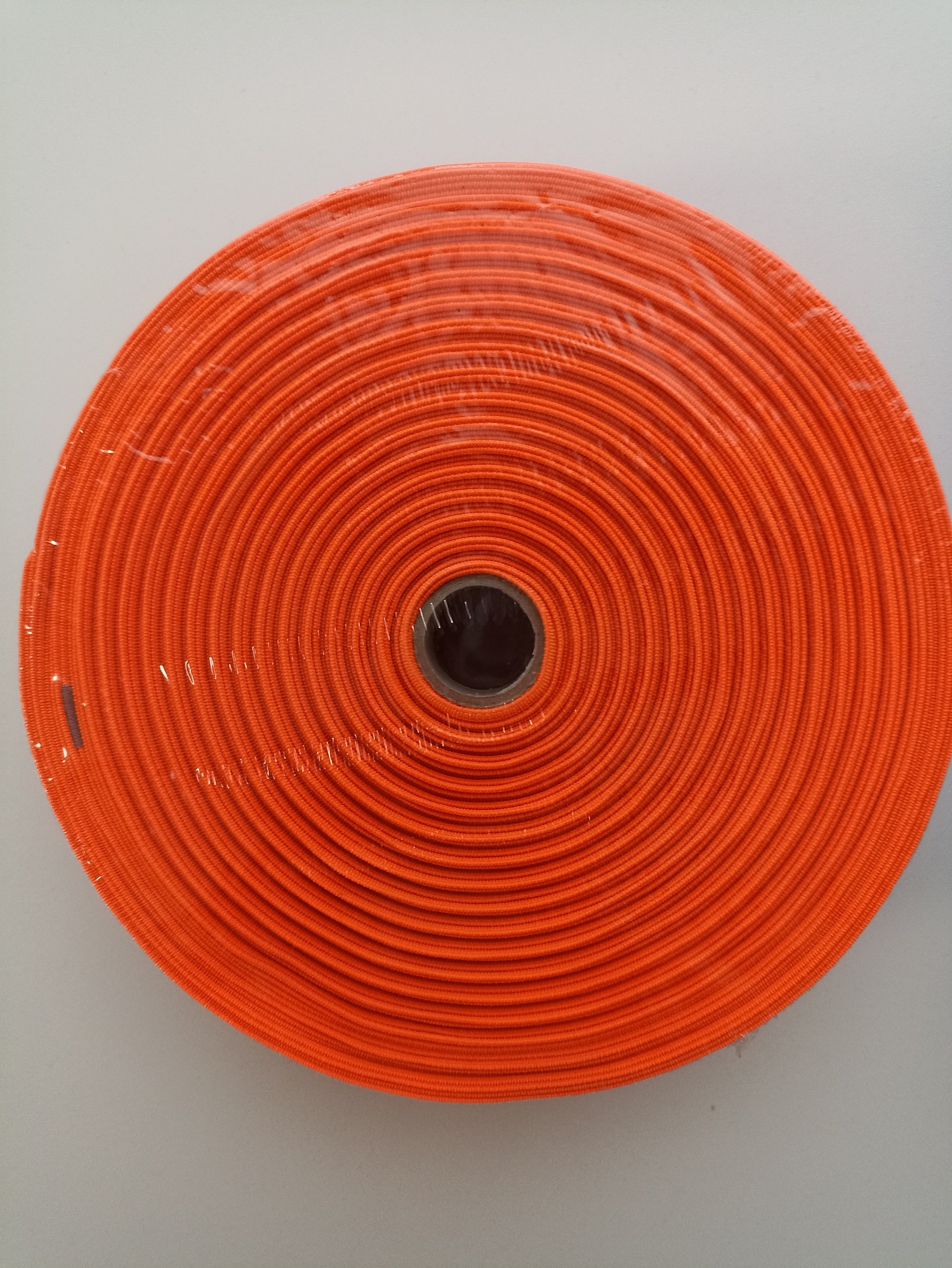 Rubber PEGA smooth width 20 mm, coil 25m, woven, orange